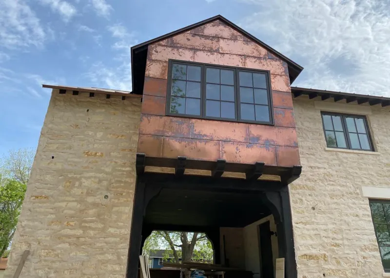 Copper metal panel facade on a stone building for Skylight Installation in Riviera Beach